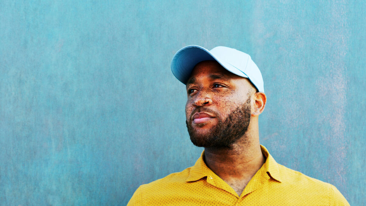 Man in baseball cap looking off camera © Tim Robberts / Getty Images